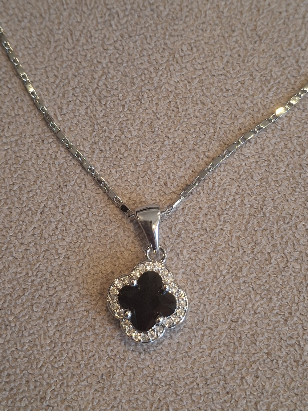 Elegant Silver Necklace with Black Clover Pendant